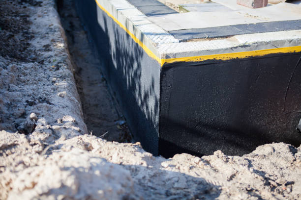 Professional Waterproofing technician working in Baldwin, WI